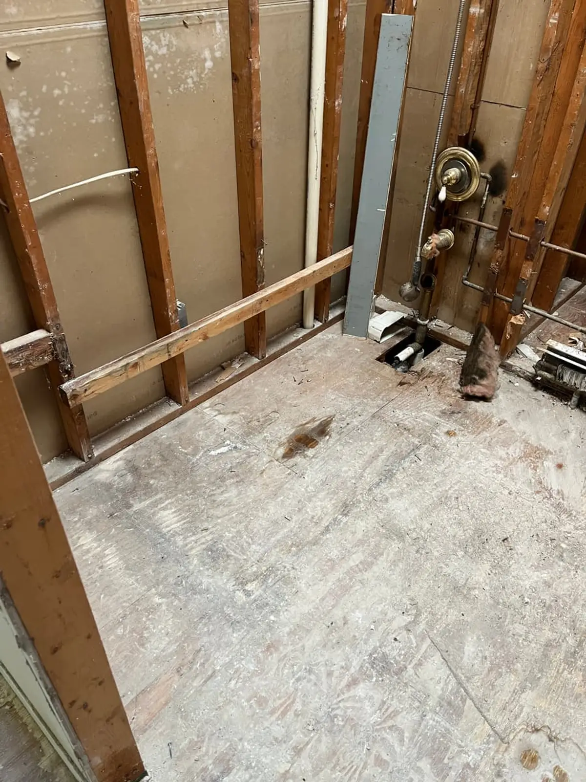 Selling a house with unpermitted work in Coram: bathroom stripped down to the studs and subfloor